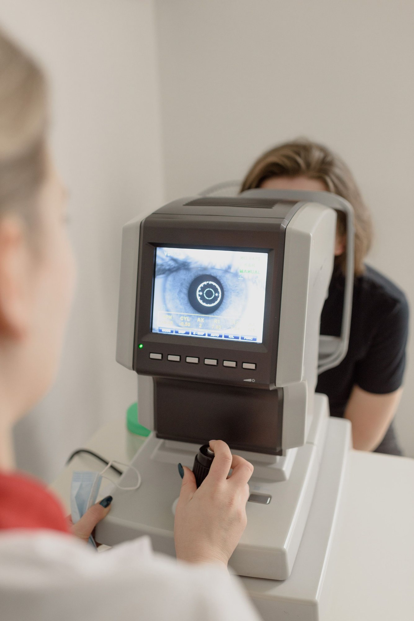 Patient being examined at an autorefractor